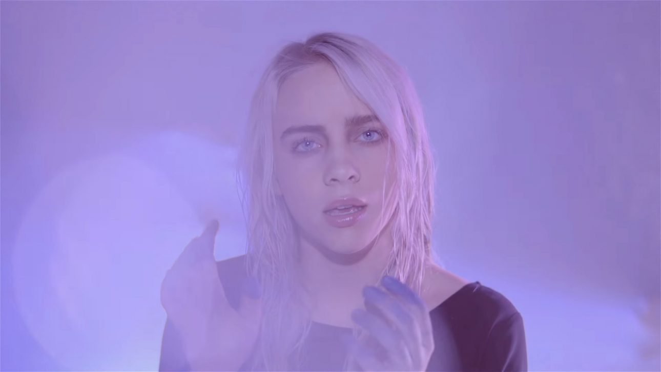 Billie Eilish reveals smoky new video for fizzing pop single “Ocean Eyes”